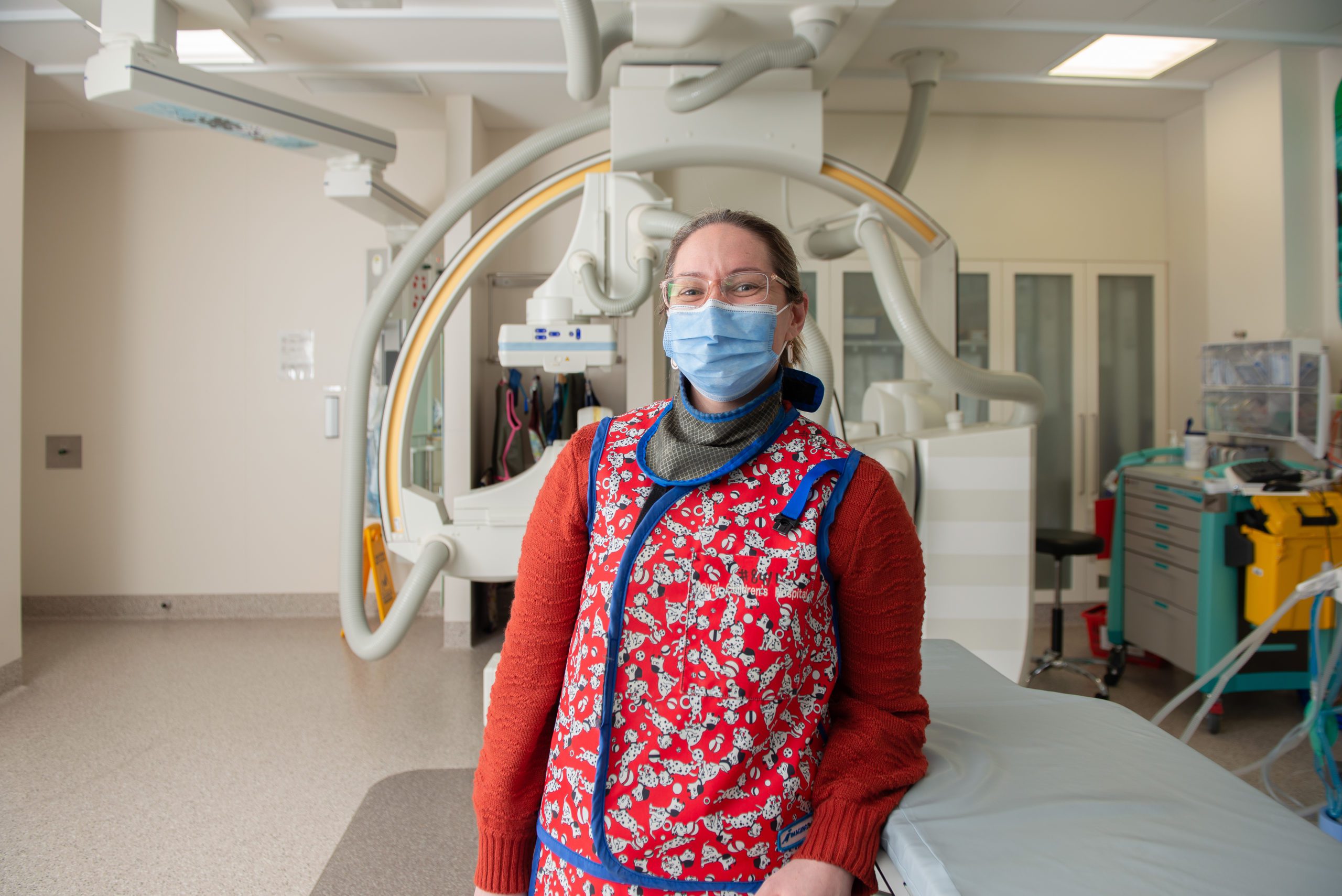 Amanda standing in front of an Xray machine